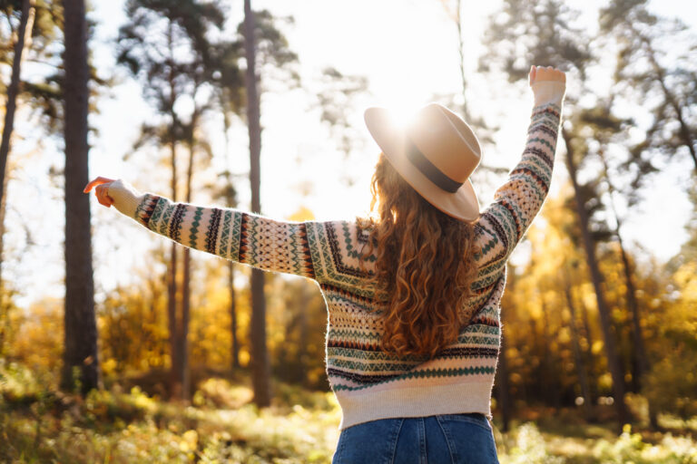 woman in a stylish sweater and hat